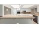 Bright kitchen with white cabinets, granite countertops, and a convenient breakfast bar at 25230 S Berry Brook Dr, Sun Lakes, AZ 85248