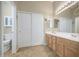 Bathroom features double sinks, ample cabinet space, and separate toilet area at 25659 W Forest Grove Ave, Buckeye, AZ 85326