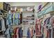 Walk-in closet provides ample storage with racks and shelves for organized clothing at 25659 W Forest Grove Ave, Buckeye, AZ 85326