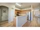 Open kitchen featuring stainless steel appliances and a breakfast bar at 25659 W Forest Grove Ave, Buckeye, AZ 85326