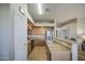 Updated kitchen features modern appliances, breakfast bar and easy access to the dining area at 25659 W Forest Grove Ave, Buckeye, AZ 85326