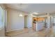 Bright kitchen and dining area featuring stainless steel appliances and wood flooring at 25659 W Forest Grove Ave, Buckeye, AZ 85326