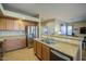 Open kitchen with island sink and stainless steel refrigerator at 25659 W Forest Grove Ave, Buckeye, AZ 85326
