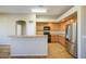 Spacious kitchen featuring stainless steel refrigerator and tiled floors at 25659 W Forest Grove Ave, Buckeye, AZ 85326
