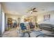 Open-concept living area with seamless flow from kitchen and dining room creates an inviting and spacious atmosphere at 25659 W Forest Grove Ave, Buckeye, AZ 85326