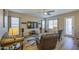 Inviting living area features neutral decor, comfortable furniture, and lots of natural light at 25659 W Forest Grove Ave, Buckeye, AZ 85326