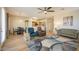 Bright living area showcasing an open layout, hardwood floors, and elegant furnishings at 25659 W Forest Grove Ave, Buckeye, AZ 85326