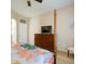 Calm main bedroom with a dresser and a view of the ensuite entrance and other decor at 25659 W Forest Grove Ave, Buckeye, AZ 85326