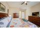 Serene main bedroom showcasing a comfortable bed, neutral walls, and ample dresser storage at 25659 W Forest Grove Ave, Buckeye, AZ 85326