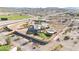 Custom home on a large lot, showcasing the pool, putting green, desert landscaping, and neighboring baseball field at 28758 N Ashbrook Ln, San Tan Valley, AZ 85144