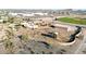 Aerial view of a home with a pool, surrounded by desert landscape, and a large detached garage at 28758 N Ashbrook Ln, San Tan Valley, AZ 85144