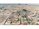 Aerial view of desert community including homes on large lots with pools, tennis courts, and detached garages at 28758 N Ashbrook Ln, San Tan Valley, AZ 85144