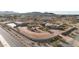 Sprawling estate features a custom home, outbuilding, circular driveway, and perimeter wall at 28758 N Ashbrook Ln, San Tan Valley, AZ 85144