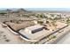 Property with large garage or shop building, desert landscaping, perimeter wall, and mountain views at 28758 N Ashbrook Ln, San Tan Valley, AZ 85144