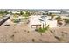 Custom home featuring a unique architectural style, solar panels, large pool, and desert landscaping at 28758 N Ashbrook Ln, San Tan Valley, AZ 85144