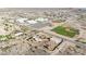 Expansive aerial view of a home featuring a pool and proximity to a school with sports facilities at 28758 N Ashbrook Ln, San Tan Valley, AZ 85144