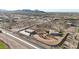 Beautiful aerial view of a desert home with a pool, circular drive, and detached garage on acreage at 28758 N Ashbrook Ln, San Tan Valley, AZ 85144