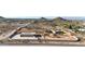 Sprawling estate features a custom home, outbuilding, circular driveway, and desert landscaping at 28758 N Ashbrook Ln, San Tan Valley, AZ 85144