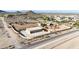 Large lot with wall, outbuilding with parking, and custom desert landscaping, set against mountain views at 28758 N Ashbrook Ln, San Tan Valley, AZ 85144