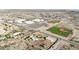 Expansive aerial view of a home featuring a pool and proximity to a school with sports facilities at 28758 N Ashbrook Ln, San Tan Valley, AZ 85144