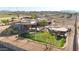 Custom home featuring a large putting green, rock pool and spa with custom waterfall features at 28758 N Ashbrook Ln, San Tan Valley, AZ 85144