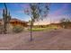 Expansive desert property featuring a putting green, unique architecture, and desert landscaping at 28758 N Ashbrook Ln, San Tan Valley, AZ 85144