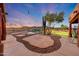Luxury backyard with desert design including custom pool, landscaping, patio, and string lights at 28758 N Ashbrook Ln, San Tan Valley, AZ 85144