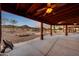 Expansive patio with a waterfall pool, outdoor kitchen and entertaining area with plenty of room for relaxing or entertaining guests at 28758 N Ashbrook Ln, San Tan Valley, AZ 85144