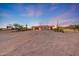 Expansive desert property featuring a putting green and unique architectural details at 28758 N Ashbrook Ln, San Tan Valley, AZ 85144