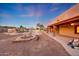 Desert backyard with pool, fire pit, covered patio, and landscaping that captures outdoor living at 28758 N Ashbrook Ln, San Tan Valley, AZ 85144
