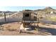 Backyard featuring large play structure including fort, slide, and ladder at 28758 N Ashbrook Ln, San Tan Valley, AZ 85144