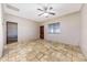 Bedroom featuring travertine flooring, neutral walls, ceiling fan, and window providing natural light at 28758 N Ashbrook Ln, San Tan Valley, AZ 85144