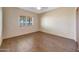 Bedroom featuring a ceiling fan, natural light, and wood-look flooring at 28758 N Ashbrook Ln, San Tan Valley, AZ 85144