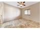 Bedroom with ceiling fan, a window, and tiled flooring at 28758 N Ashbrook Ln, San Tan Valley, AZ 85144