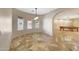 Bright breakfast nook with natural light and an adjacent games room with a pool table at 28758 N Ashbrook Ln, San Tan Valley, AZ 85144