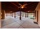 Enjoy the outdoors on this expansive covered patio with ceiling fans, offering stunning views of the pool and putting green at 28758 N Ashbrook Ln, San Tan Valley, AZ 85144