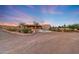 Desert landscaped property featuring an inviting circular driveway and a Southwestern style home at 28758 N Ashbrook Ln, San Tan Valley, AZ 85144