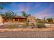 Beautiful Southwestern style home with desert landscaping and stone accented flower beds at 28758 N Ashbrook Ln, San Tan Valley, AZ 85144