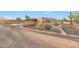 Southwestern home with a circular driveway and desert landscaping at 28758 N Ashbrook Ln, San Tan Valley, AZ 85144