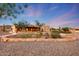 Beautiful Southwestern style home with desert landscaping and stone accented flower beds at 28758 N Ashbrook Ln, San Tan Valley, AZ 85144