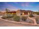 Desert home featuring southwestern architecture, circular drive, and a two-car garage at 28758 N Ashbrook Ln, San Tan Valley, AZ 85144