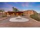 Attractive desert home with a unique southwestern architectural design and circular walkway at 28758 N Ashbrook Ln, San Tan Valley, AZ 85144