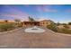 Desert home featuring a spacious driveway with concrete design and native landscaping under twilight sky at 28758 N Ashbrook Ln, San Tan Valley, AZ 85144