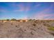 Desert landscaped property features a covered patio and pool with waterfall at 28758 N Ashbrook Ln, San Tan Valley, AZ 85144