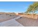 View of the property from a walkway through the desert landscape at 28758 N Ashbrook Ln, San Tan Valley, AZ 85144