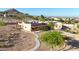 Elevated view of the house featuring beautiful landscaping and a covered walkway leading to the entrance at 28758 N Ashbrook Ln, San Tan Valley, AZ 85144