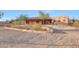 Charming Southwestern home featuring desert landscaping and covered porch at 28758 N Ashbrook Ln, San Tan Valley, AZ 85144