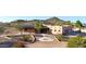 Charming southwestern-style home featuring a landscaped front yard and mountain views at 28758 N Ashbrook Ln, San Tan Valley, AZ 85144