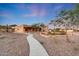 Beautiful southwestern home featuring desert landscaping and a concrete path at 28758 N Ashbrook Ln, San Tan Valley, AZ 85144