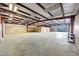 Spacious garage with shelving and concrete flooring at 28758 N Ashbrook Ln, San Tan Valley, AZ 85144